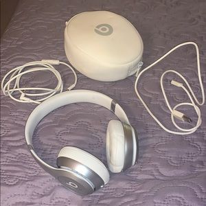 Small white wireless Beats headphones